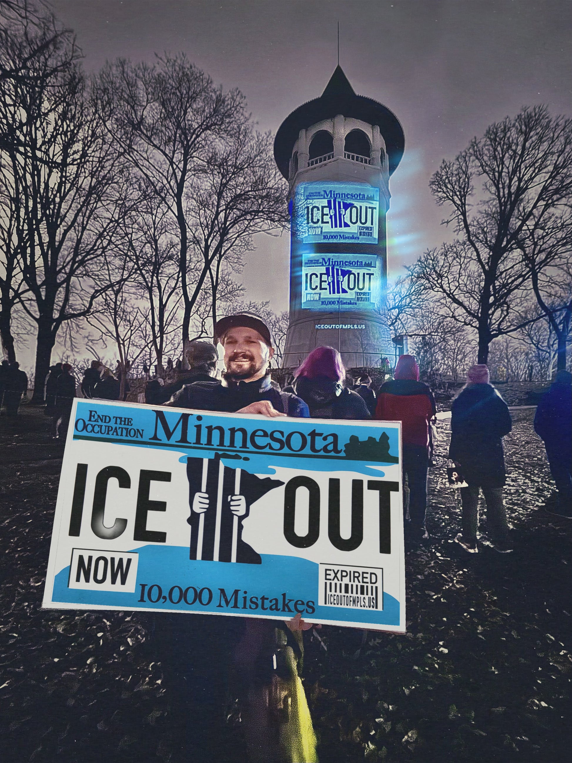 Activist holding Large format print ICE OUT MN license plate protest poster at Minneapolis rally